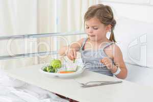 Girl having healthy food in hospital