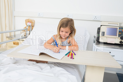 Sick girl coloring book in hospital