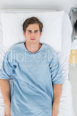 Handsome patient lying in bed