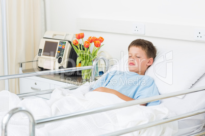 Boy sleeping in hospital ward