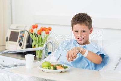 Boy having healthy food in hospital