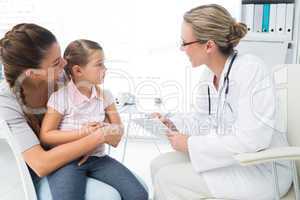 Mother and daughter visiting doctor