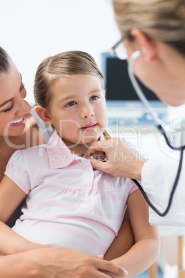 Girl being examined by pediatrician