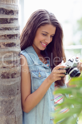 Stylish young girl looking at her camera