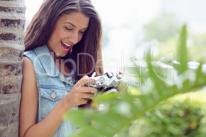 Stylish happy girl looking at her camera