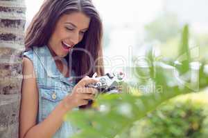 Stylish happy girl looking at her camera