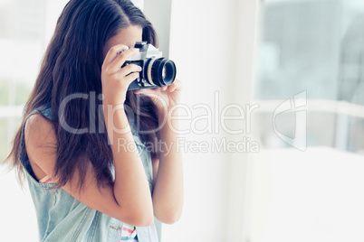 Stylish young photographer taking a photo