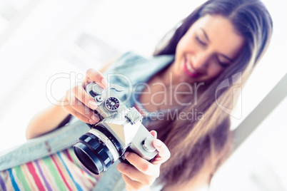 Smiling brunette looking at her camera