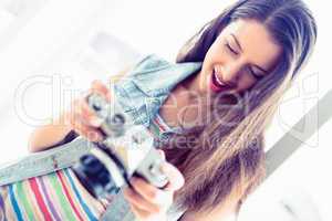 Cheerful brunette looking at her camera