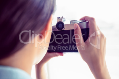 Brunette taking a photo