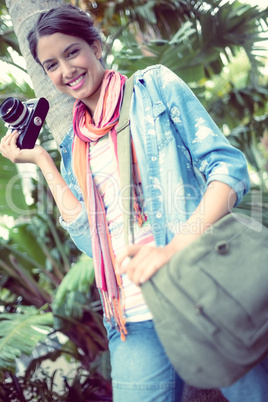 Happy photographer standing outside smiling at camera