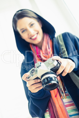 Attractive brunette holding her camera