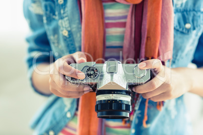 Young woman looking at her camera