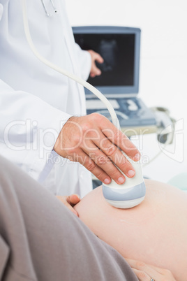 Pregnant woman having a sonagram scan