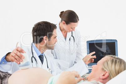 Cheerful pregnant blonde woman having an ultrasound scan