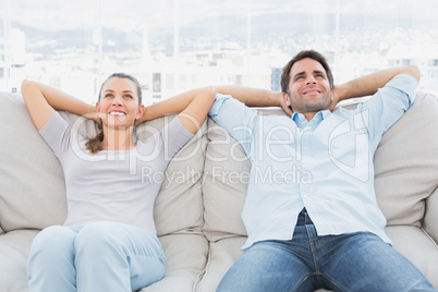 Happy couple relaxing on the couch