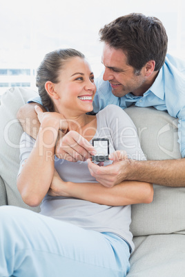 Happy woman being surprised by a marraige proposal