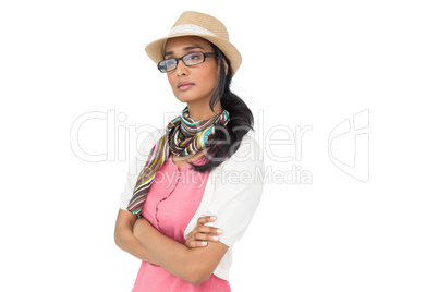 Serious cool young woman with arms crossed