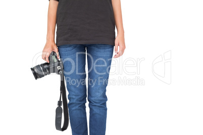 Mid section of a woman holding camera