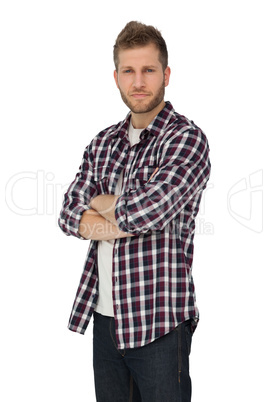 Portrait of a young man with arms crossed