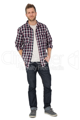 Portrait of a young man with hands in pockets