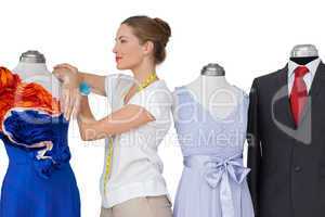 Female fashion designer and mannequins