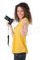 Portrait of a female photographer gesturing thumbs up