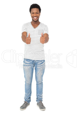 Portrait of a happy young man gesturing thumbs up