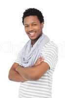 Portrait of a smiling young man with arms crossed