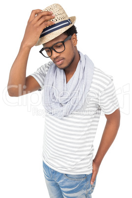 Portrait of a cool serious young man wearing hat
