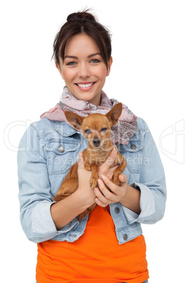 Portrait of a smiling young woman with pet dog