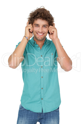 Portrait of a young man enjoying music