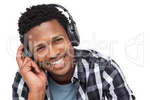Close-up portrait of a young man enjoying music