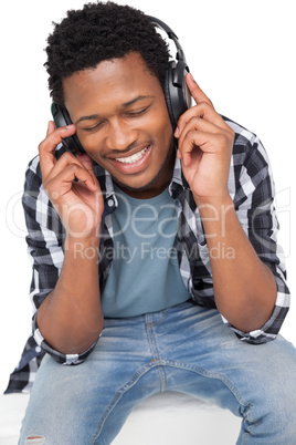 Close-up of a young man enjoying music