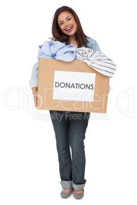 Portrait of a young woman with clothes donation