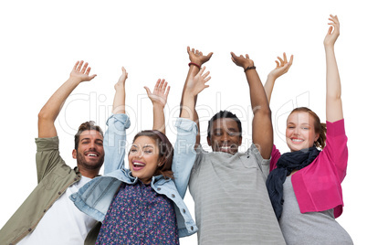 Portrait of four young friends raising hands