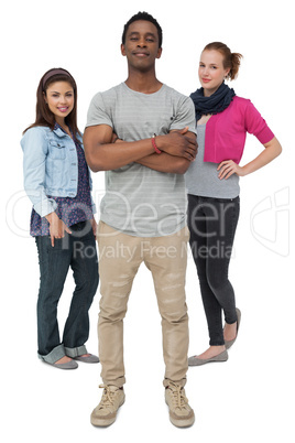 Full length portrait of three happy young people