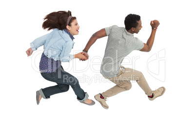 Side view of a cheerful couple jumping