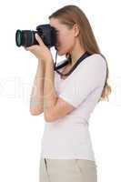 Side view of a young woman with camera