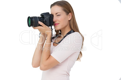 Side view of a young woman with camera