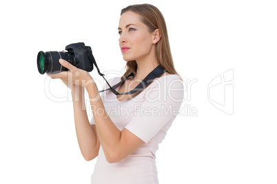 Side view of a young woman with camera