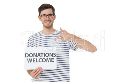 Man pointing at donation welcome note