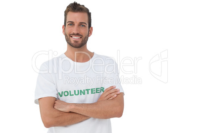 Portrait of a happy male volunteer with hands crossed