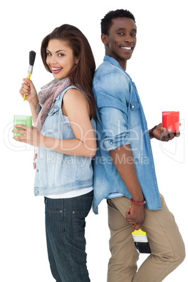 Portrait of a couple with paintbrushes and containers