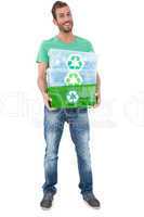 Portrait of a smiling young man carrying recycle containers