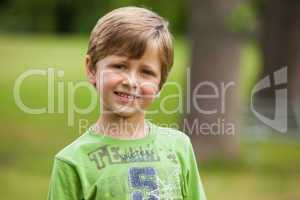 Portrait of a smiling young boy at park