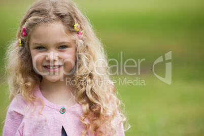 Close-up portrait of smiling girl at park