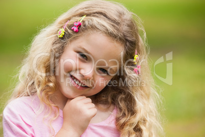 Close-up portrait of smiling girl at park