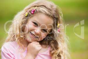 Close-up portrait of smiling girl at park