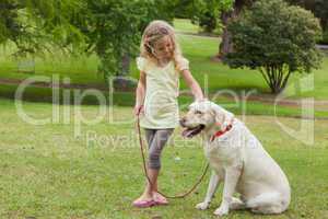 Young girl with pet dog at park